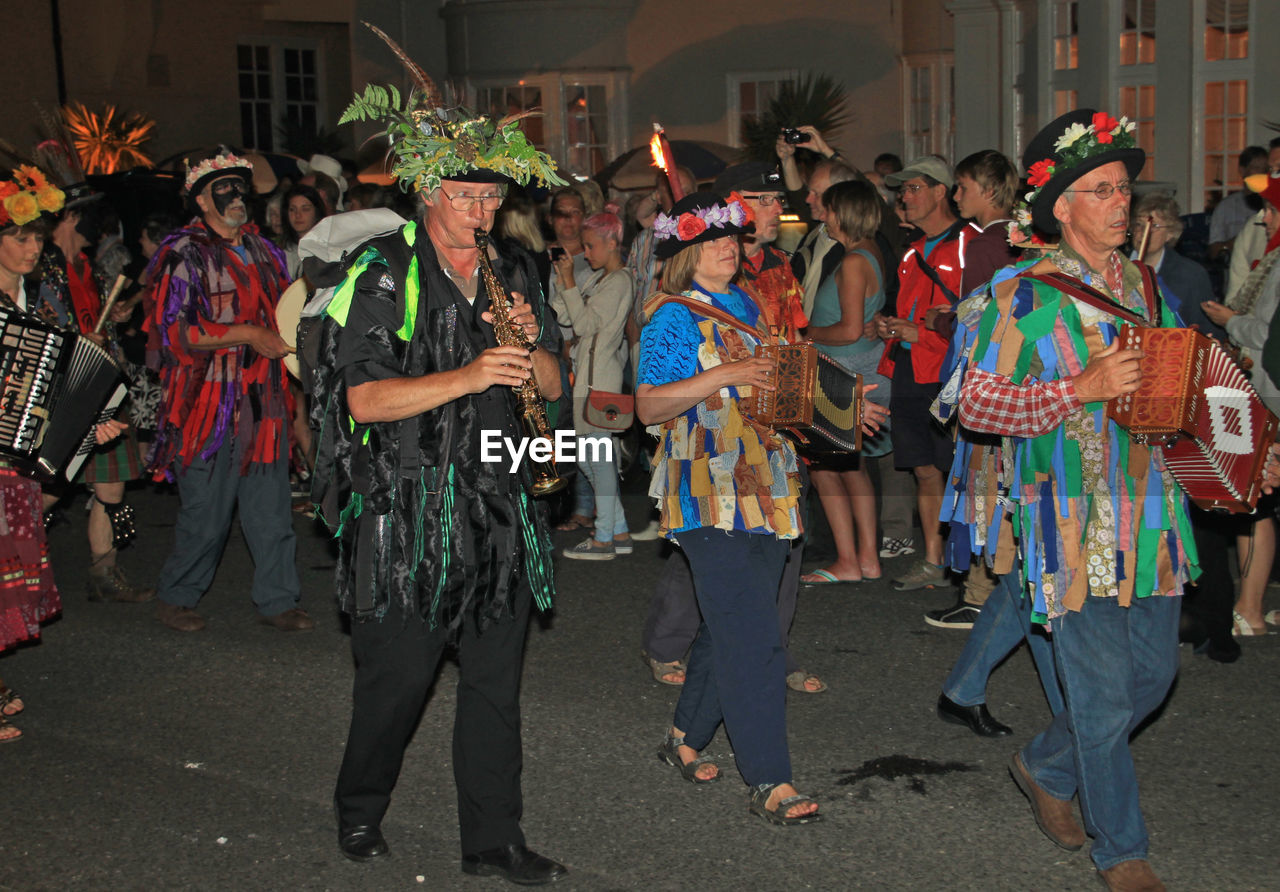 GROUP OF PEOPLE IN STREET