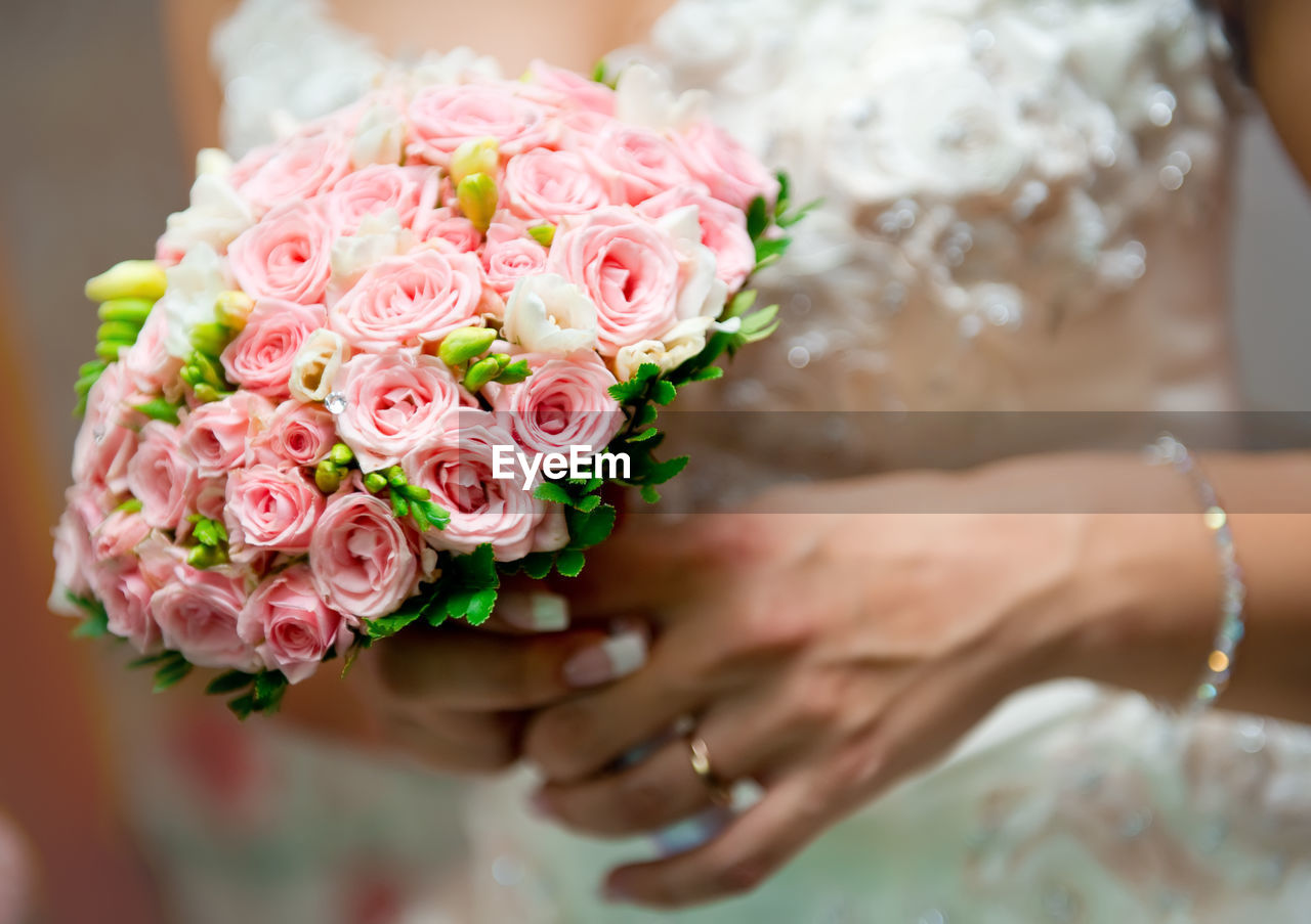 Close-up of woman holding bouquet