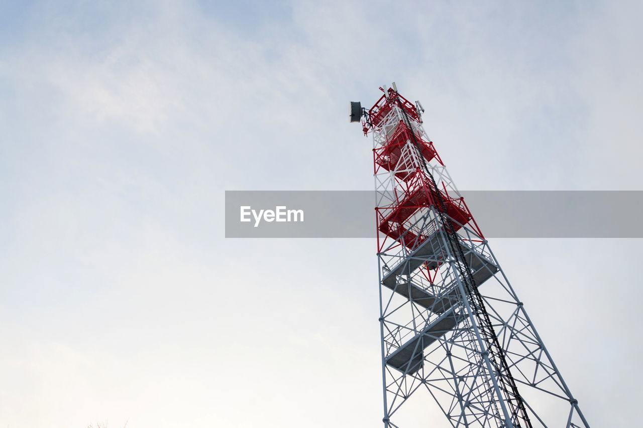 Low angle view of crane against sky