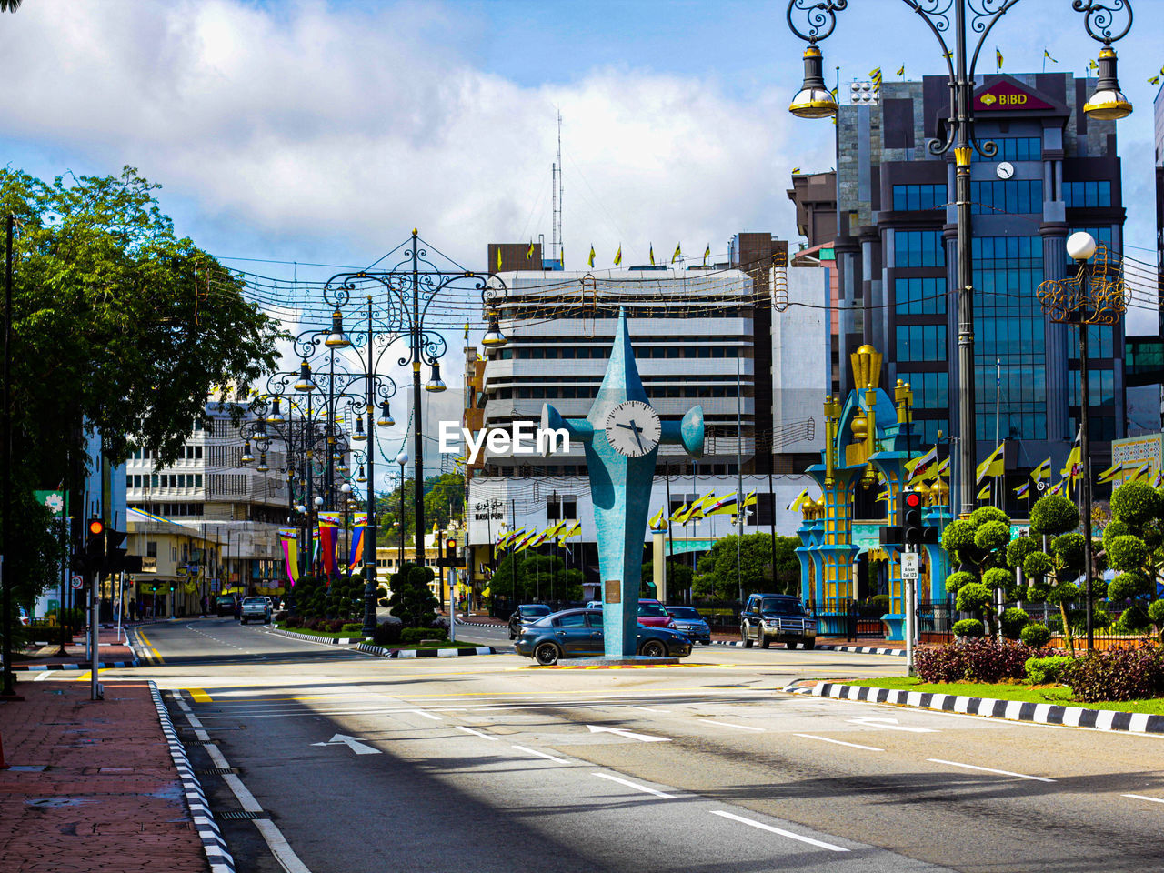 VIEW OF CITY STREET AND BUILDINGS AGAINST SKY