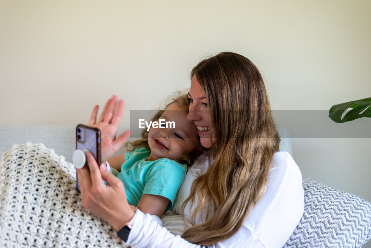 MOTHER AND DAUGHTER WHILE USING PHONE