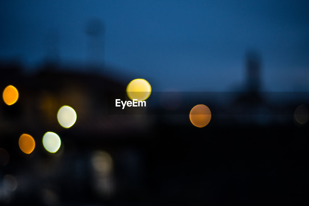 Defocused image of illuminated lights at night