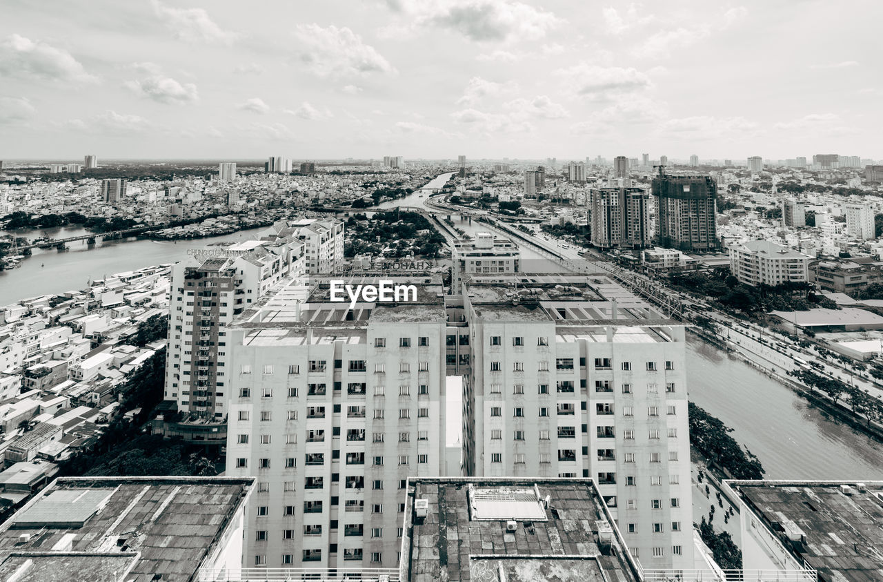 High angle view of buildings in city against sky