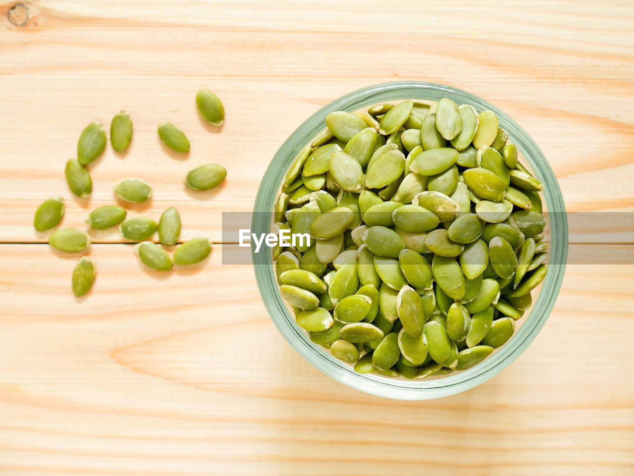 food and drink, food, plant, healthy eating, wellbeing, produce, freshness, broad bean, vegetable, indoors, green, fruit, seed, pea, bowl, dish, no people, wood, still life, large group of objects, table, raw food, high angle view, crop, directly above, green pea, studio shot, organic, snap pea, close-up