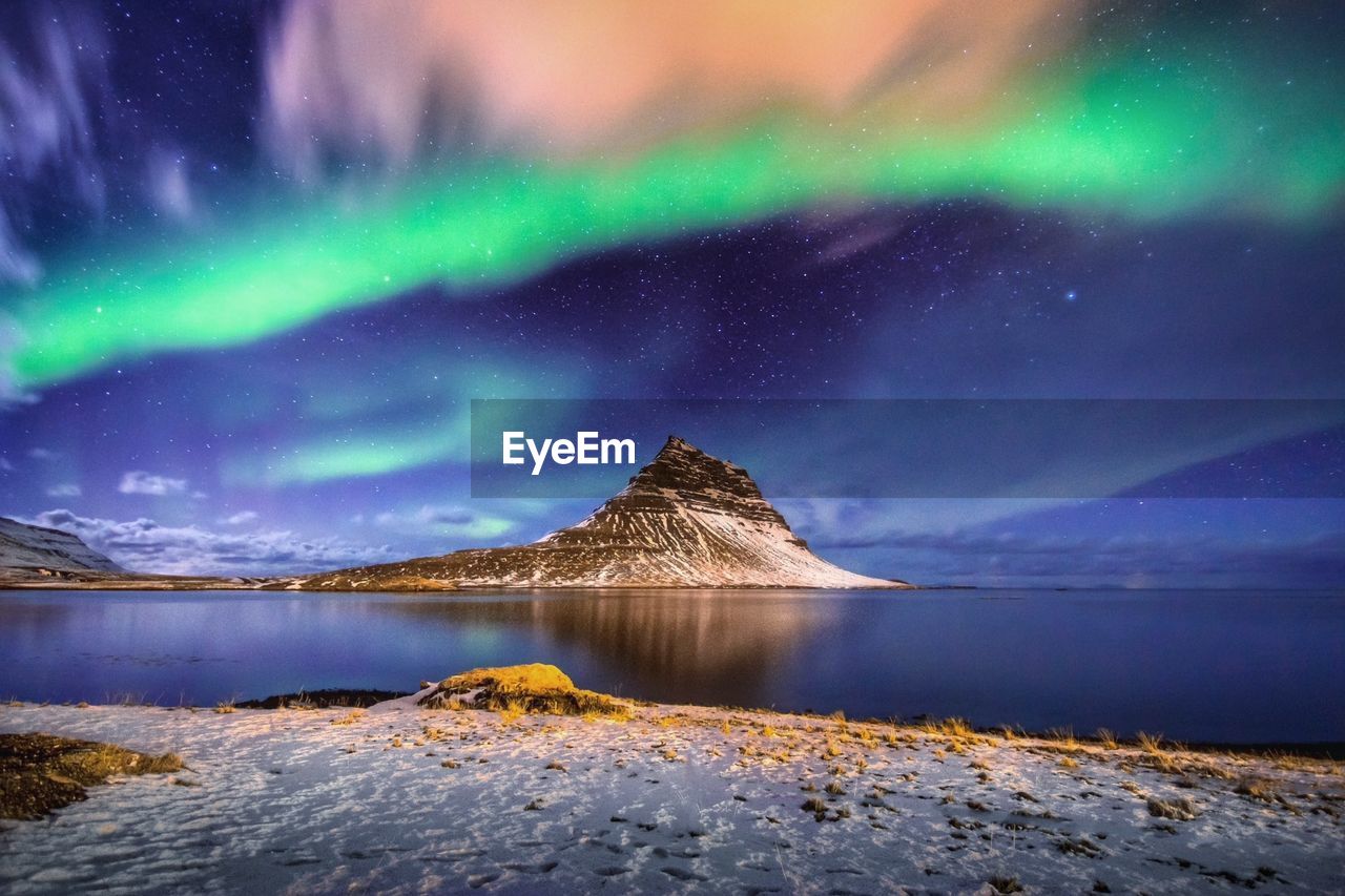 Aurora borealis effect on lake at dusk