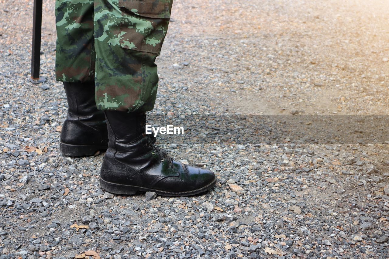 Low section of man standing on floor