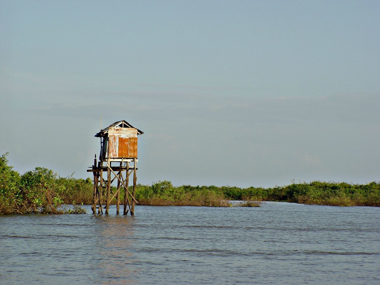 LIFEGUARD HUT IN SEA AGAINST SKY