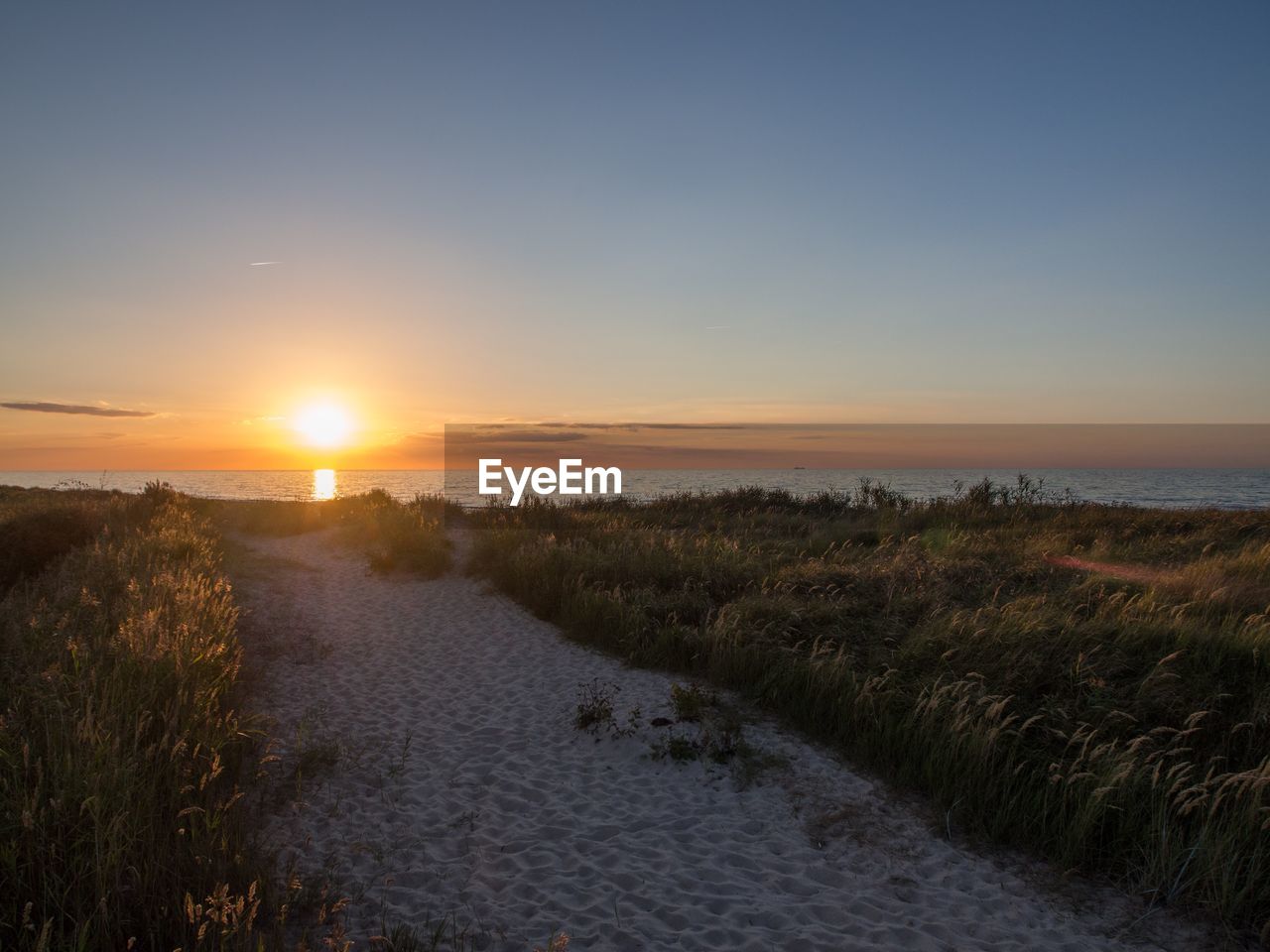 SCENIC VIEW OF SEA DURING SUNSET