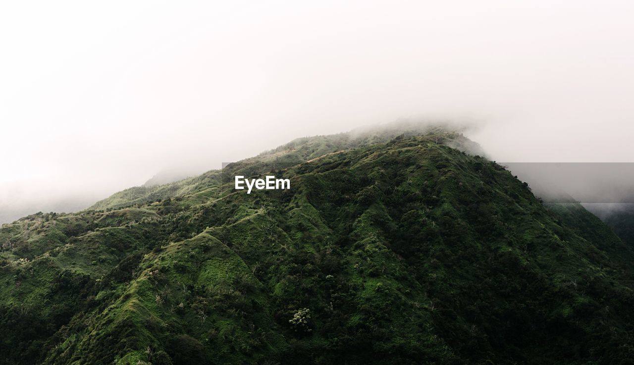 Low angle view of mountain during foggy weather