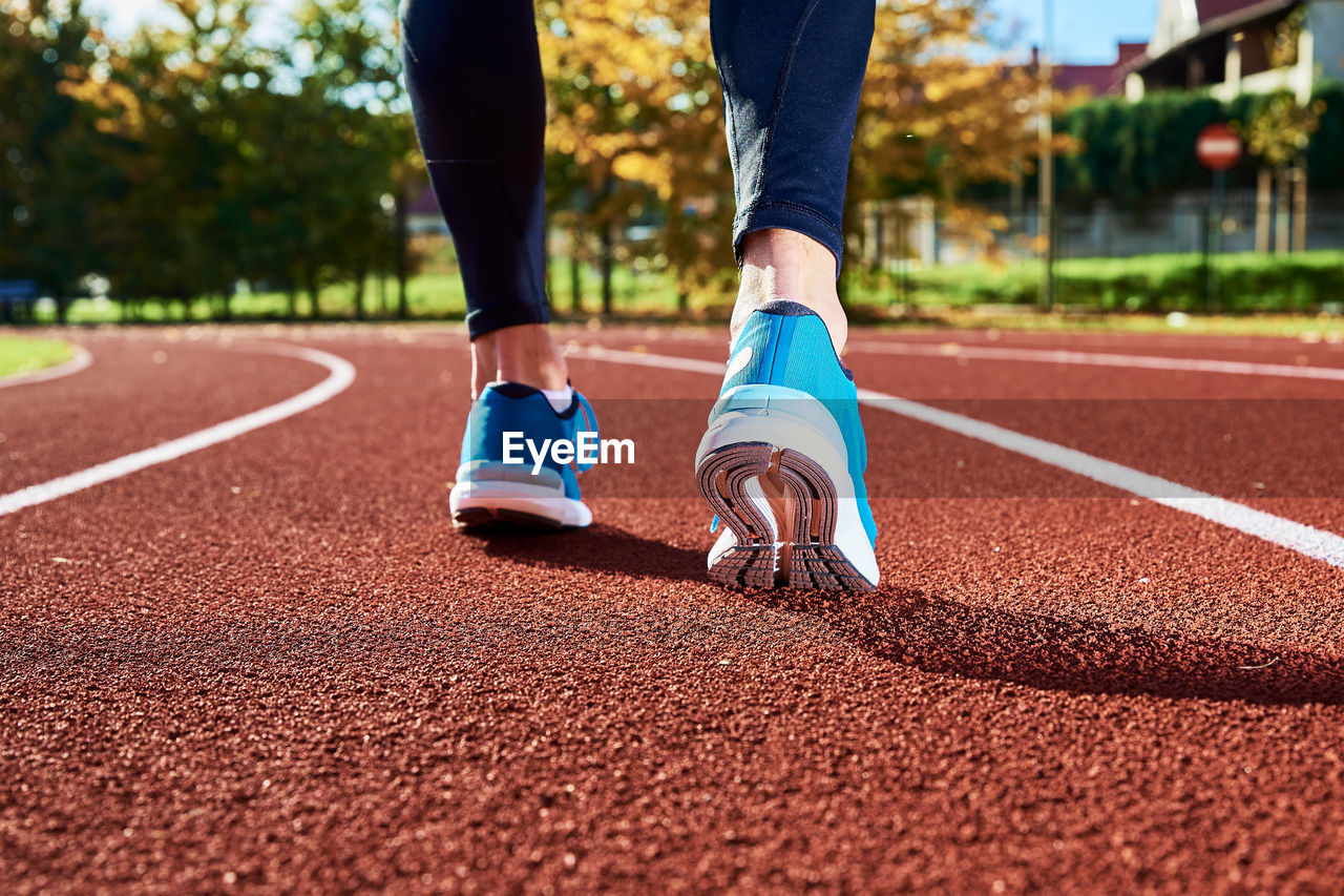 Running sneakers at stadium track