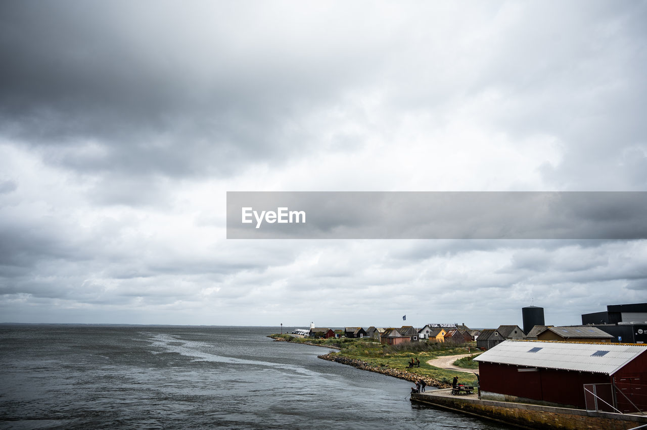 cloud, water, sky, sea, architecture, built structure, coast, nature, horizon, ocean, building exterior, overcast, shore, building, nautical vessel, storm, no people, scenics - nature, travel destinations, transportation, land, beach, environment, beauty in nature, vehicle, day, outdoors, city, cloudscape, travel, dramatic sky, storm cloud, house, bay, landscape, tourism, copy space, pier, horizon over water