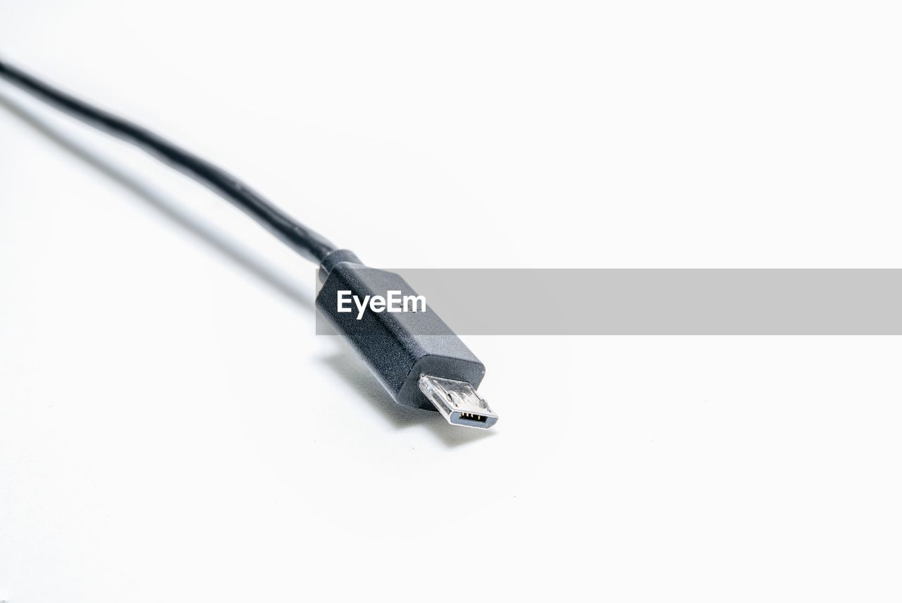 Close-up of usb cable over white background