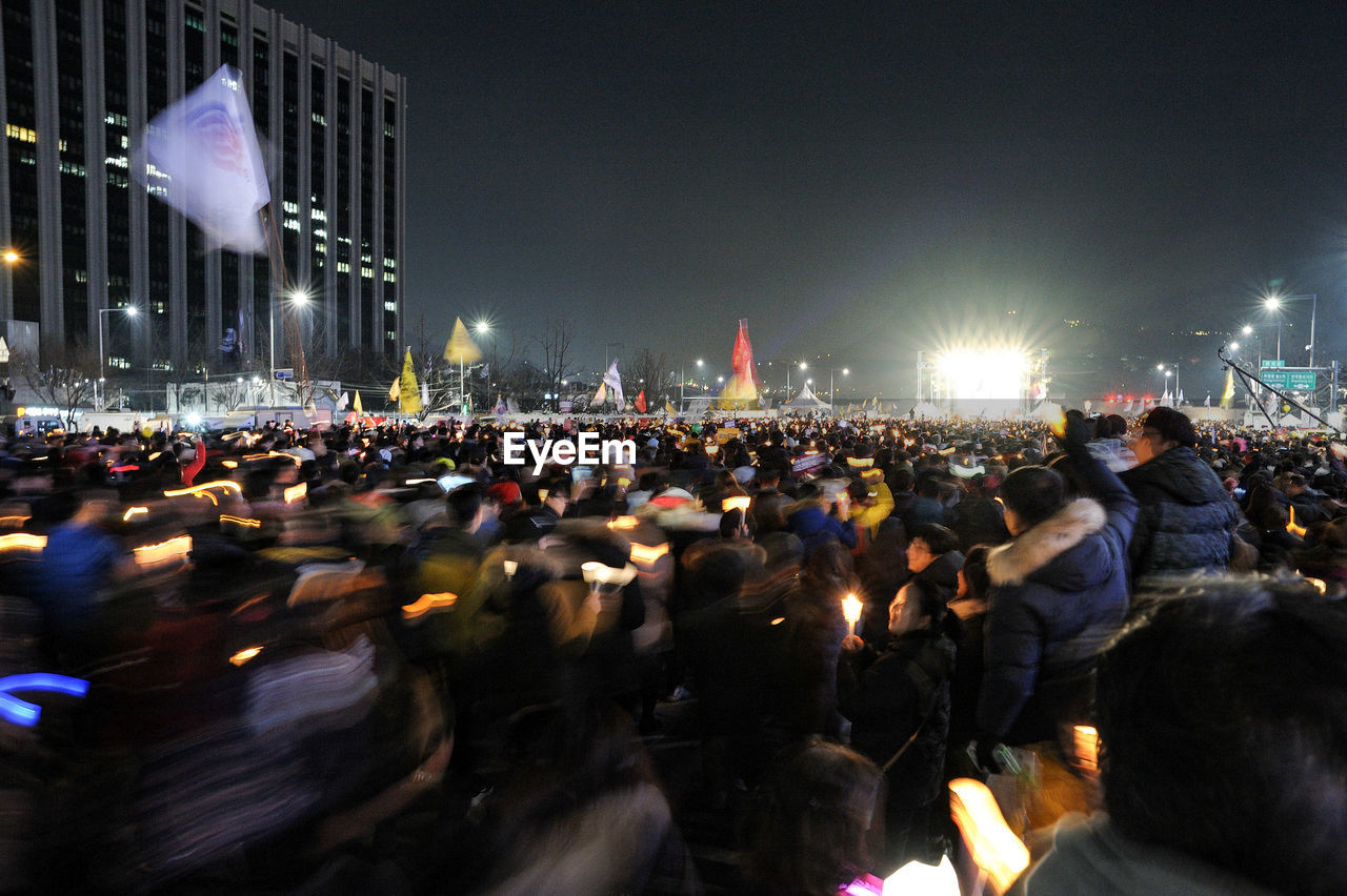 GROUP OF PEOPLE IN THE DARK