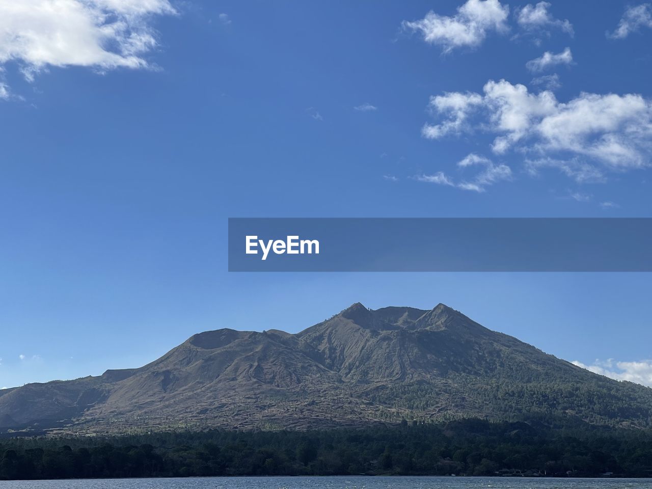 VIEW OF VOLCANIC MOUNTAIN AGAINST SKY