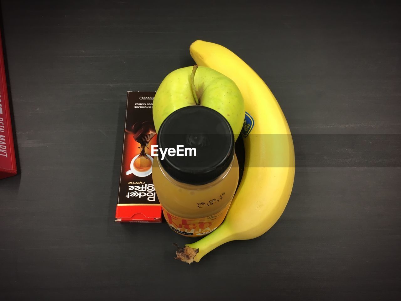 HIGH ANGLE VIEW OF YELLOW AND DRINK ON TABLE