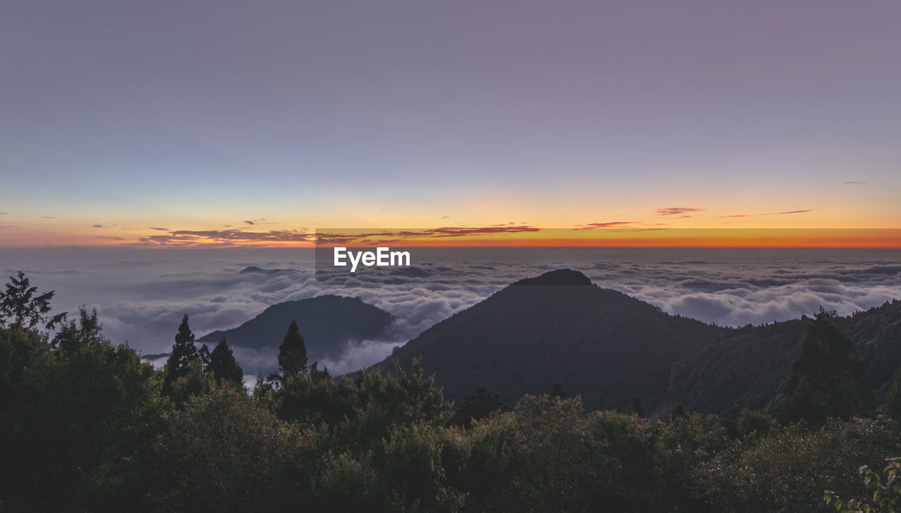 Scenic view of mountains against sky during sunset