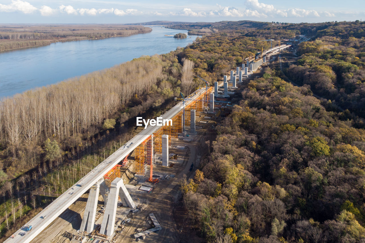 Aerial view of bridge construction amidst trees