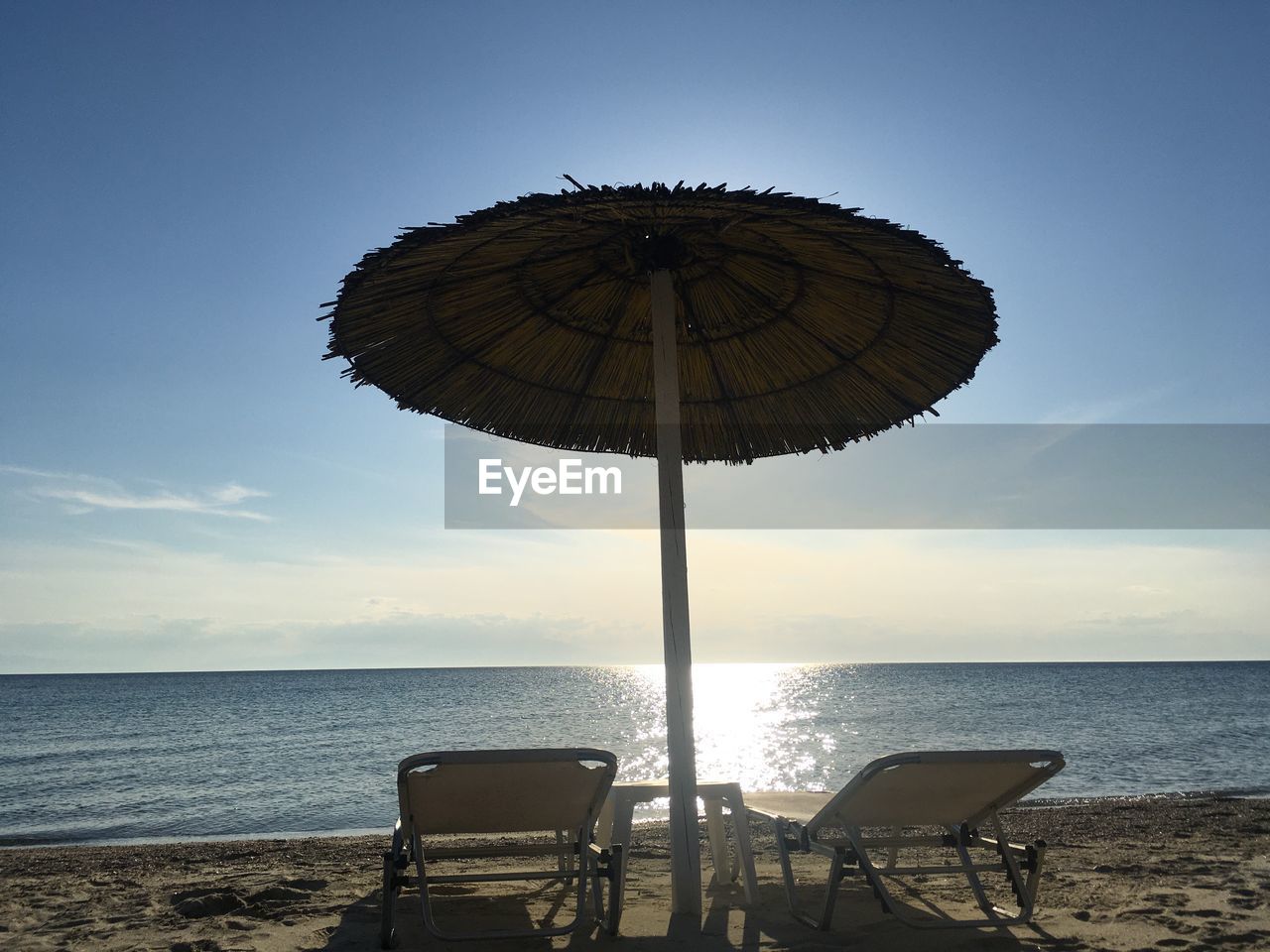 LIFEGUARD CHAIR ON BEACH AGAINST SKY