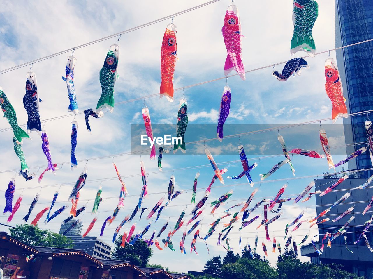 Low angle view of japanese lanterns hanging against sky