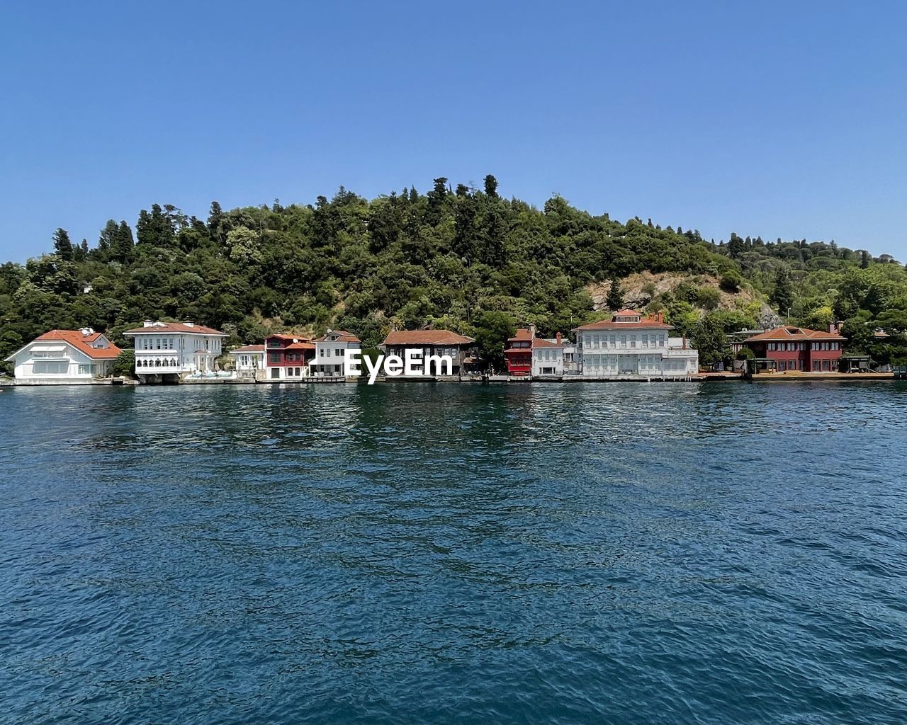 Scenic view of sea against clear blue sky