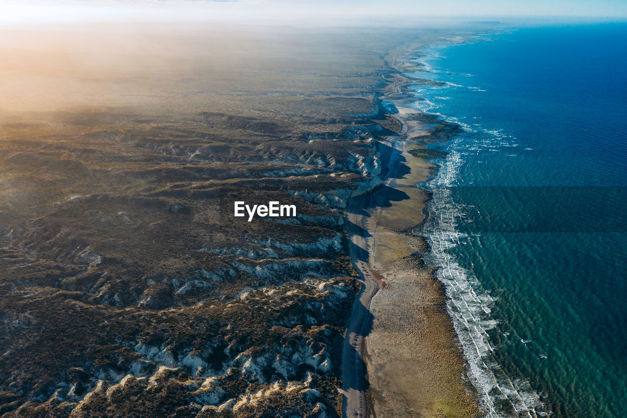 High angle view of sea shore against sky