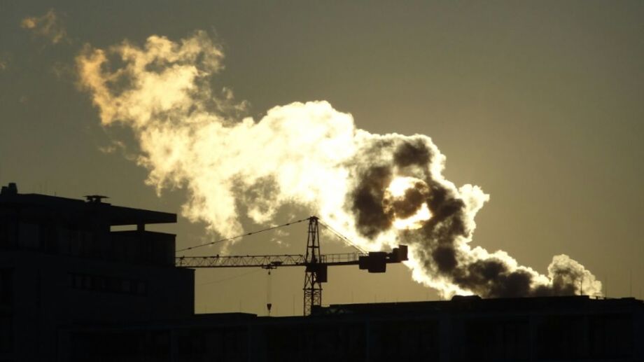 LOW ANGLE VIEW OF BUILDINGS AGAINST CLOUDY SKY AT SUNSET