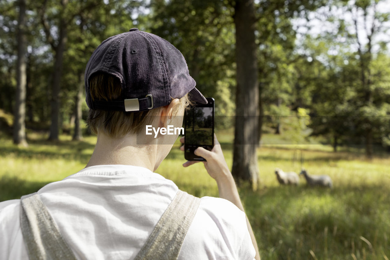 Man photographing with cell phone