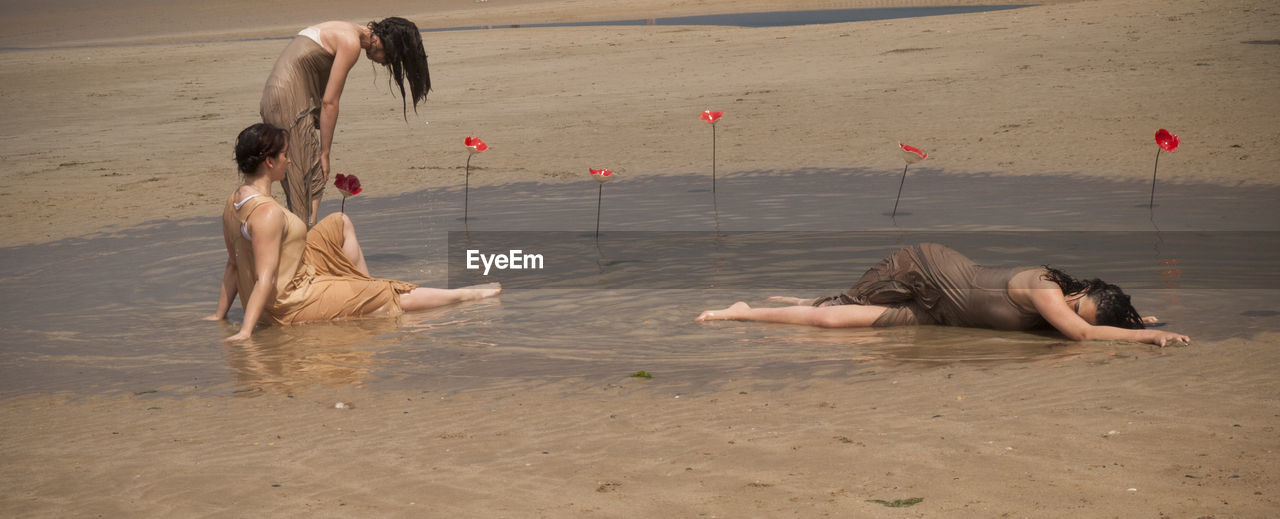 CHILDREN PLAYING AT BEACH