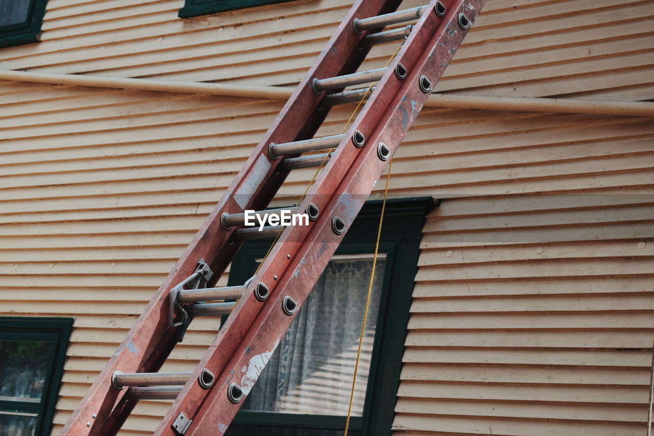 Ladder against wall outside house