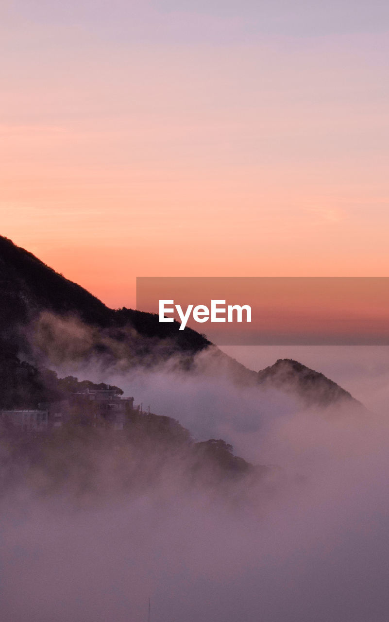 Scenic view of mountains against sky during sunset