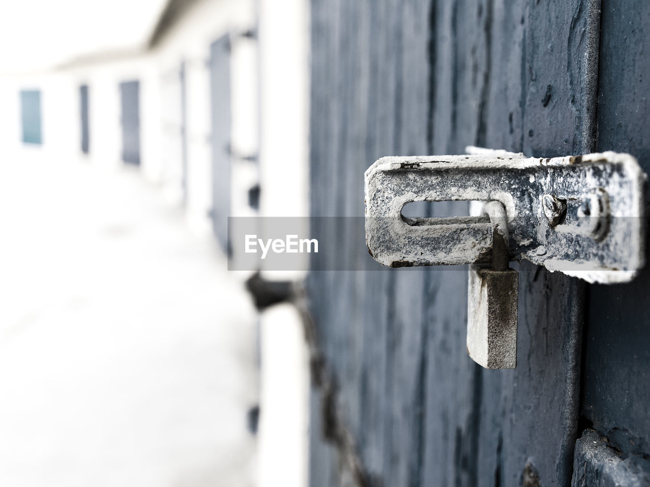 CLOSE-UP OF OPEN DOOR ON WALL