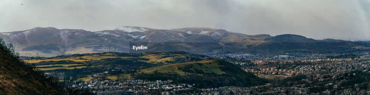 Panoramic view of townscape against mountains