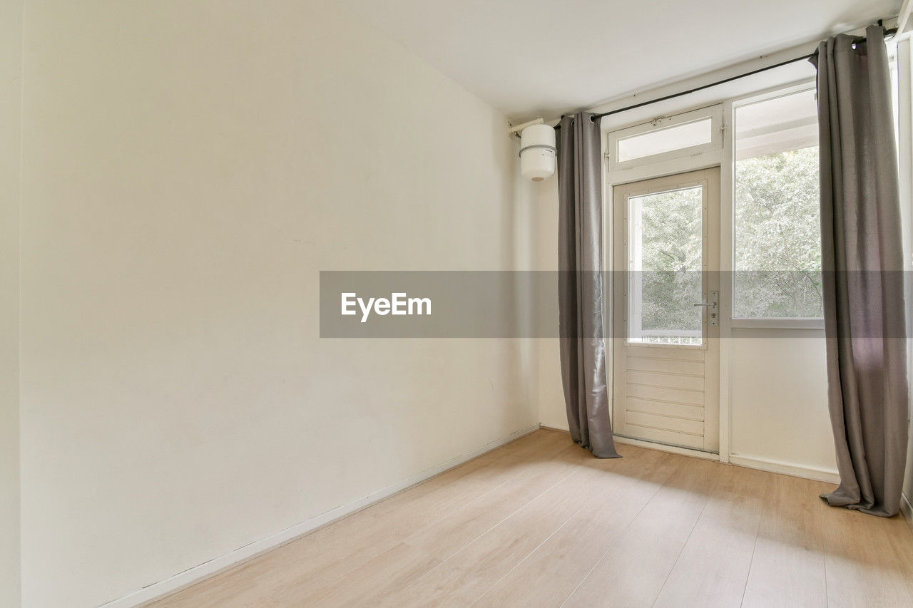 home interior, indoors, window, floor, architecture, flooring, hardwood floor, room, hardwood, domestic room, wood, home ownership, diy, interior design, apartment, parquet floor, building, house, wall - building feature, laminate flooring, wood flooring, home improvement, home, no people, empty, built structure, beginnings, copy space, real estate, construction industry, residential district, home showcase interior, lifestyles, improvement, entrance, door, day, simplicity, nature, moving house, luxury, white, wealth, sparse, bedroom