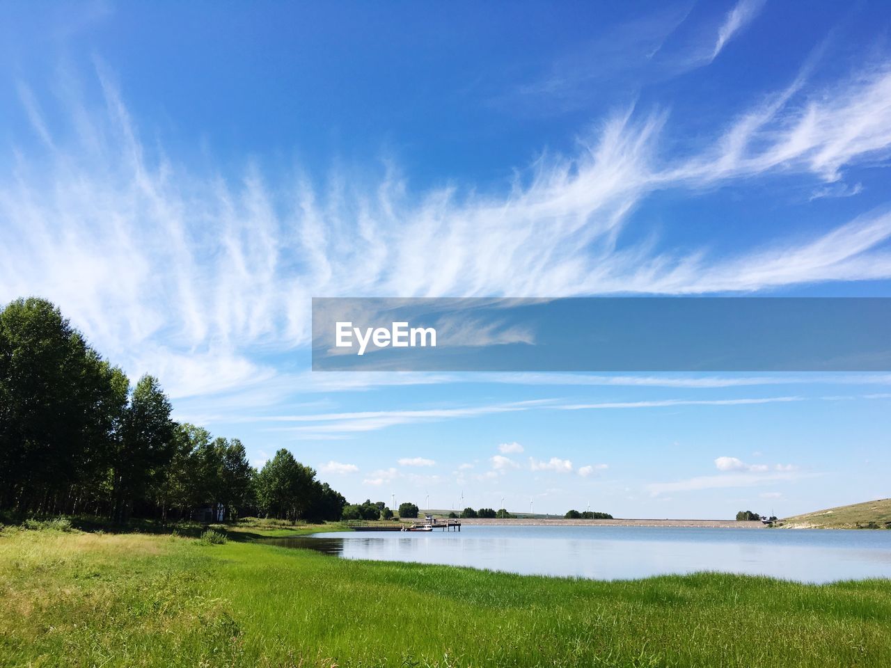 Scenic view of sea against blue sky