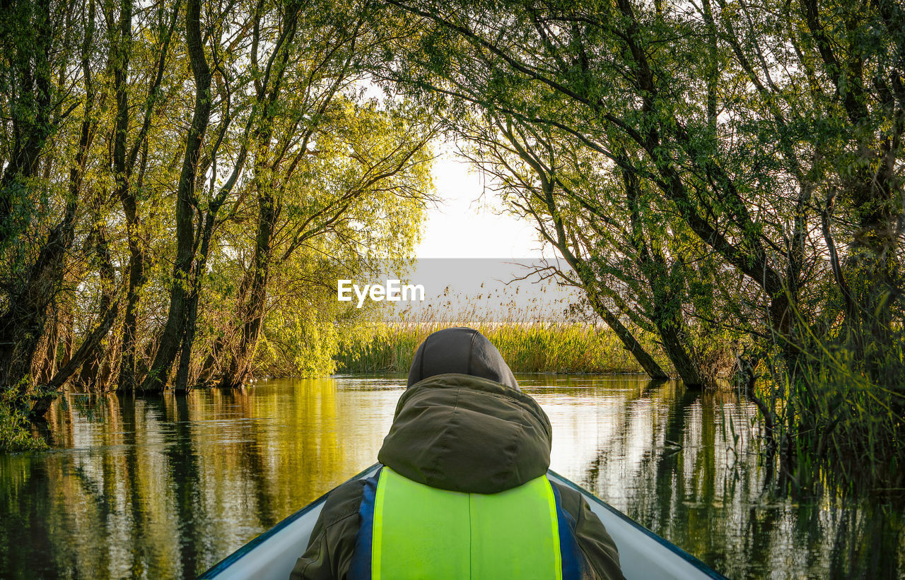 Tourist in boat in danube delta