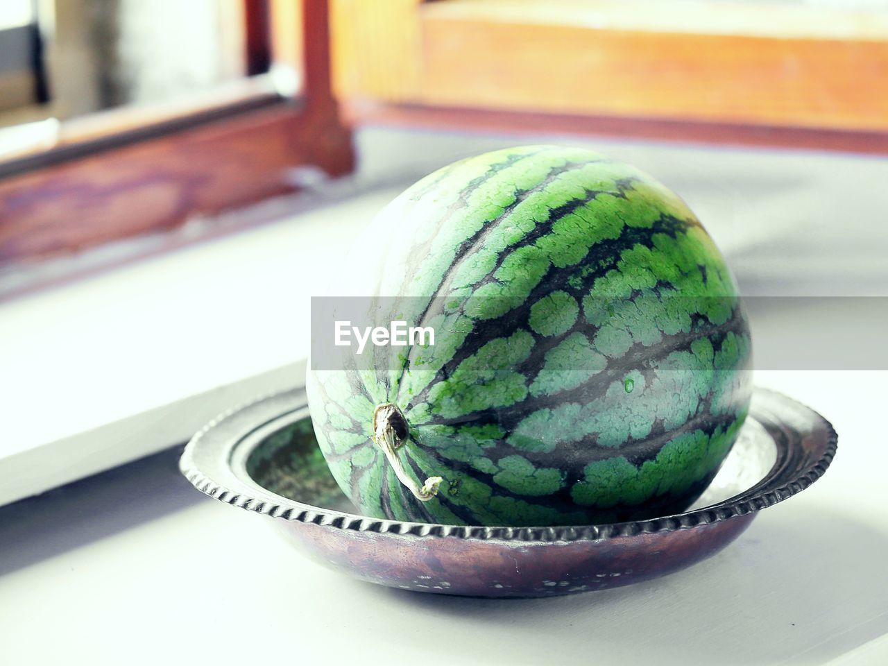 Watermelon in plate on table at home