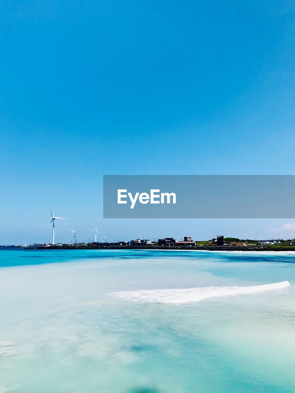 VIEW OF SEA AGAINST BLUE SKY