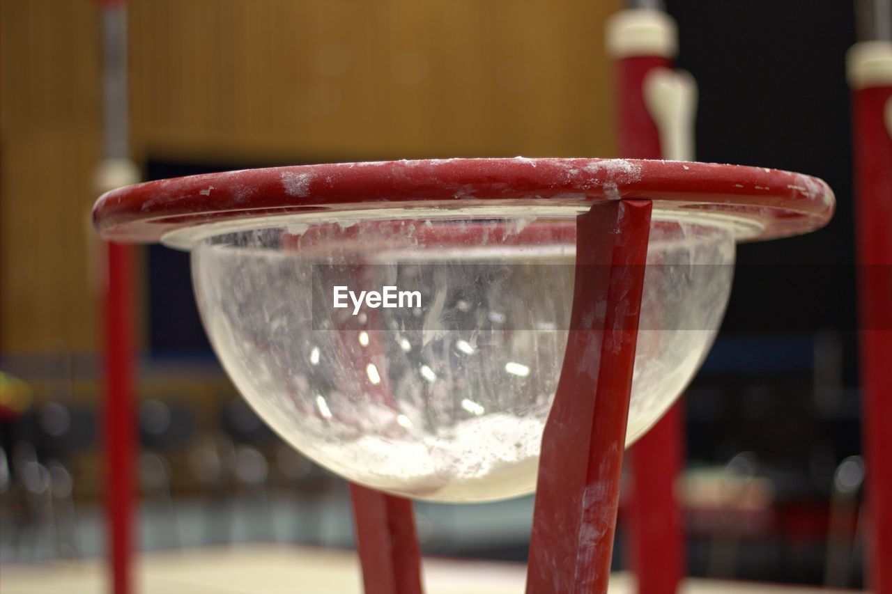 CLOSE-UP OF WINE GLASS ON TABLE