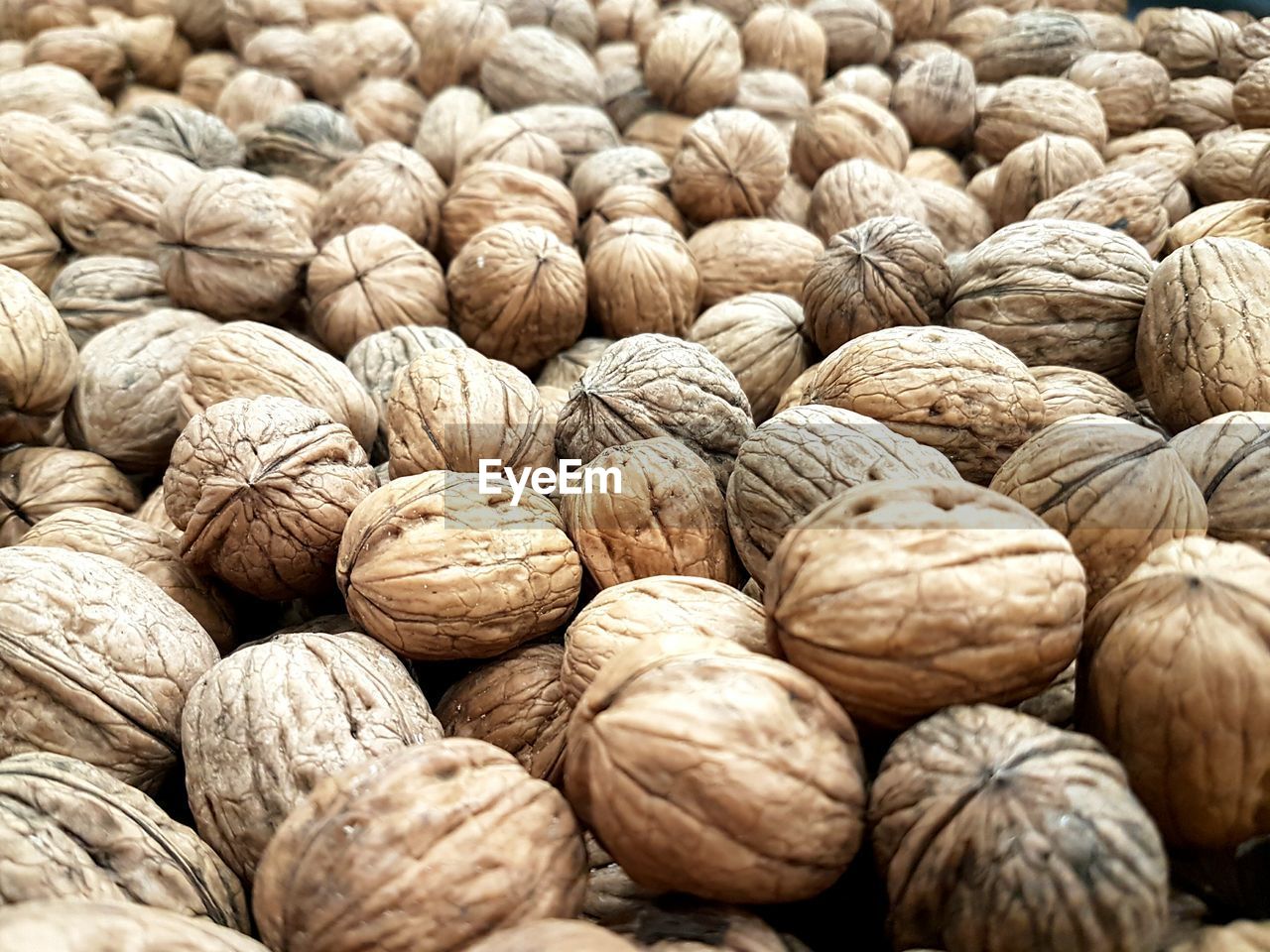 Full frame shot of walnuts for sale at market stall