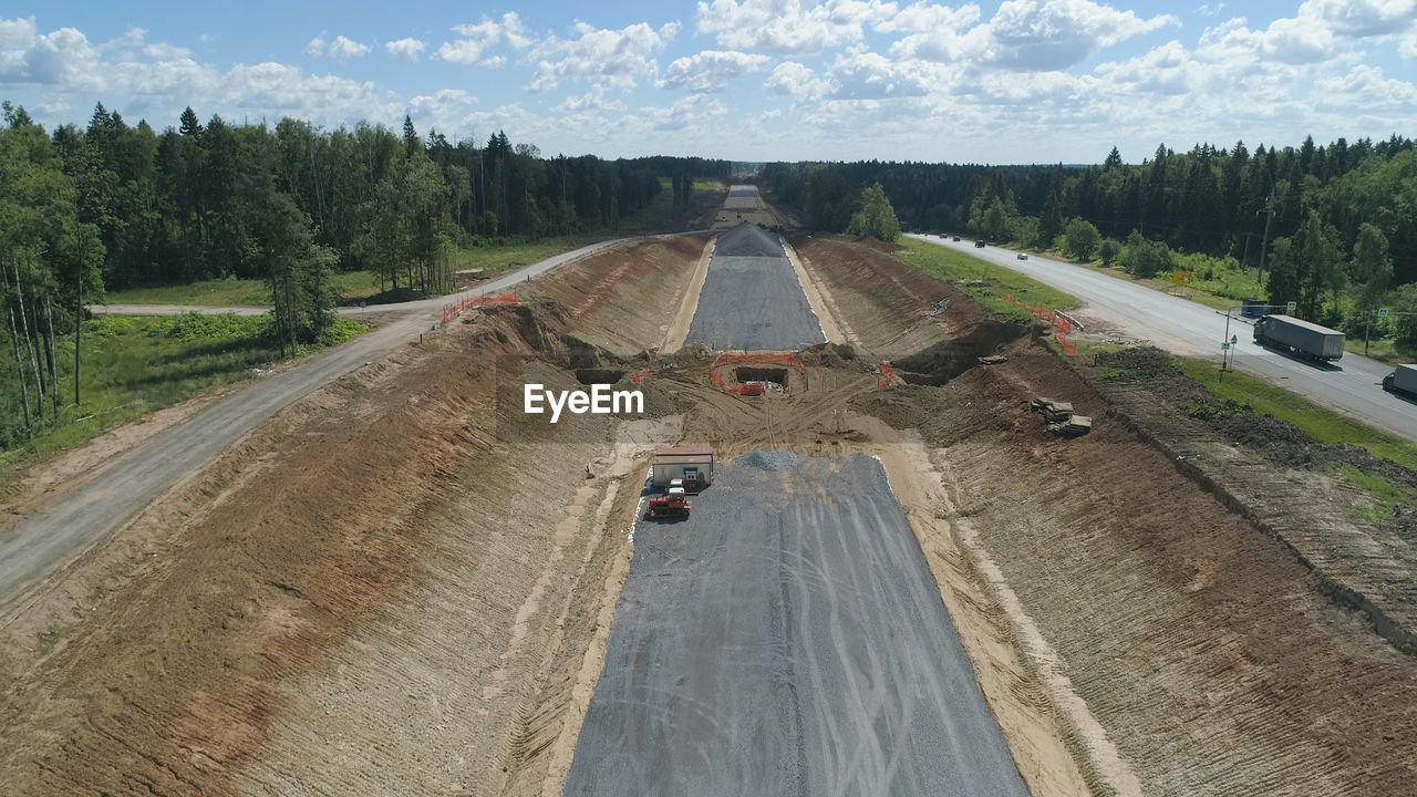 Construction of toll roads in rural areas. construction of a new highway next to the old highway.