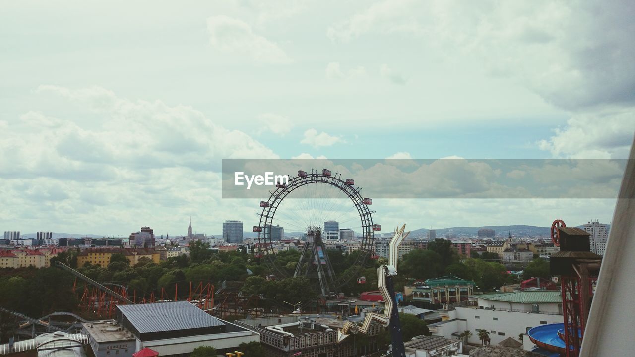 High angle view of cityscape with ferris wheel