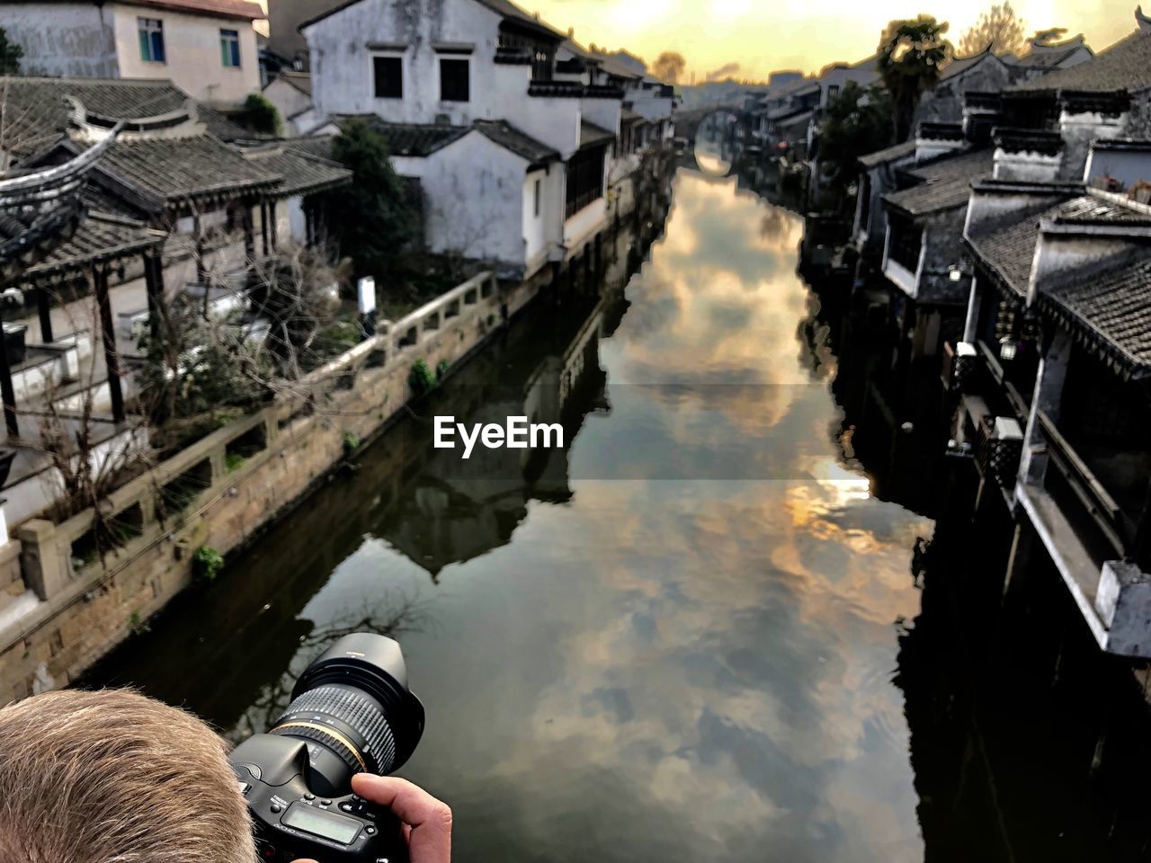 HIGH ANGLE VIEW OF CAMERA ON RIVERBANK