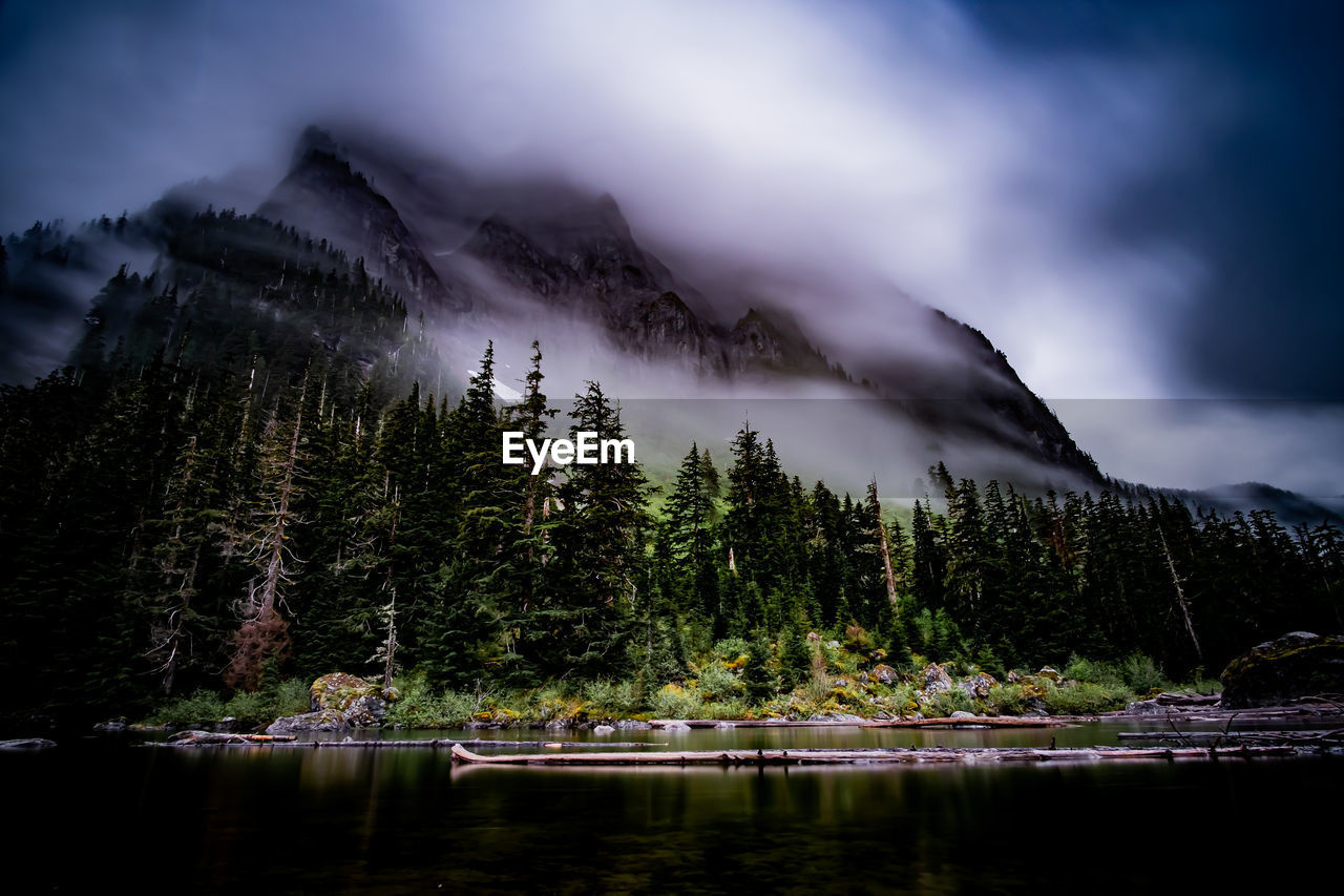 Scenic view of lake and mountains against sky