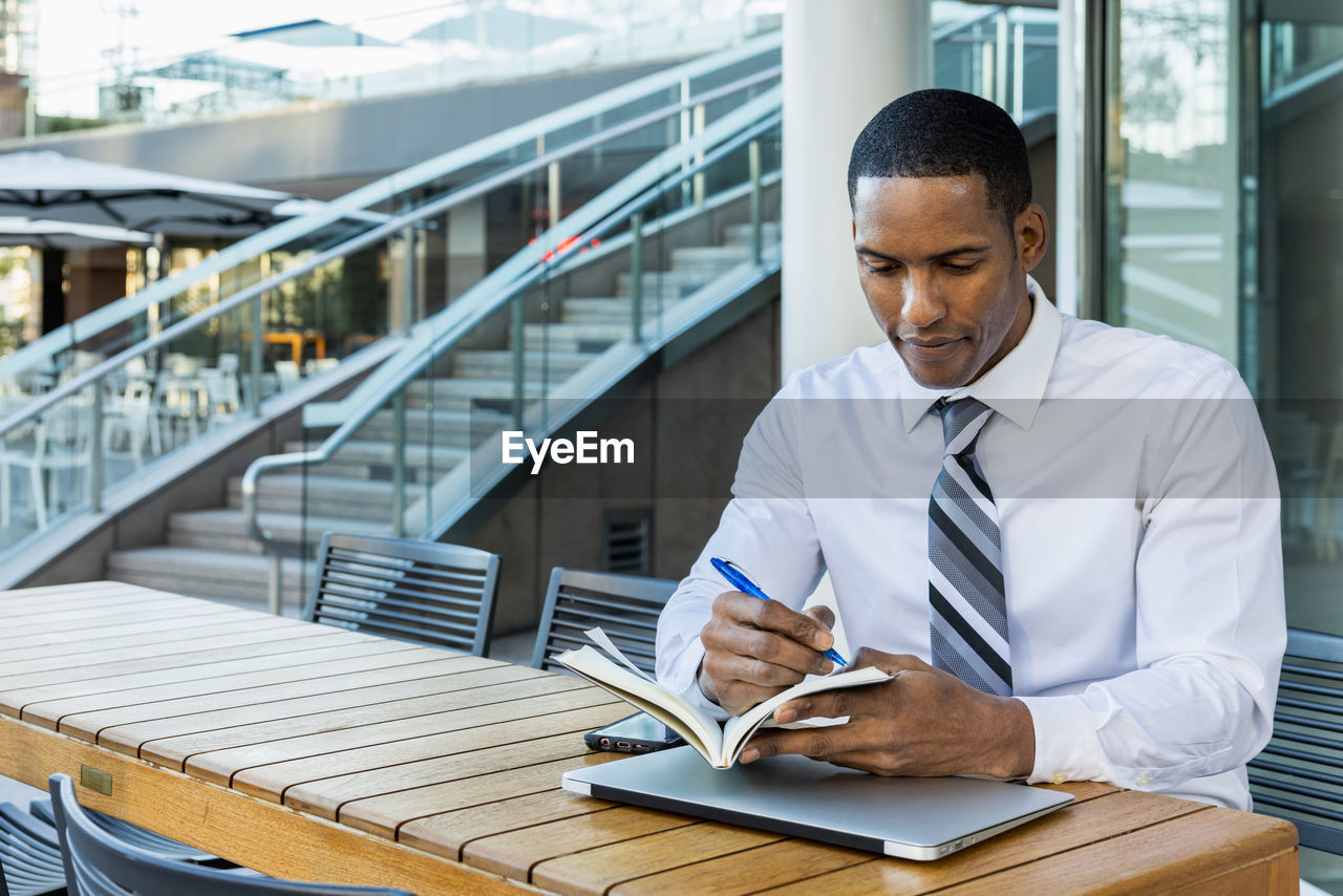 portrait of businessman using mobile phone