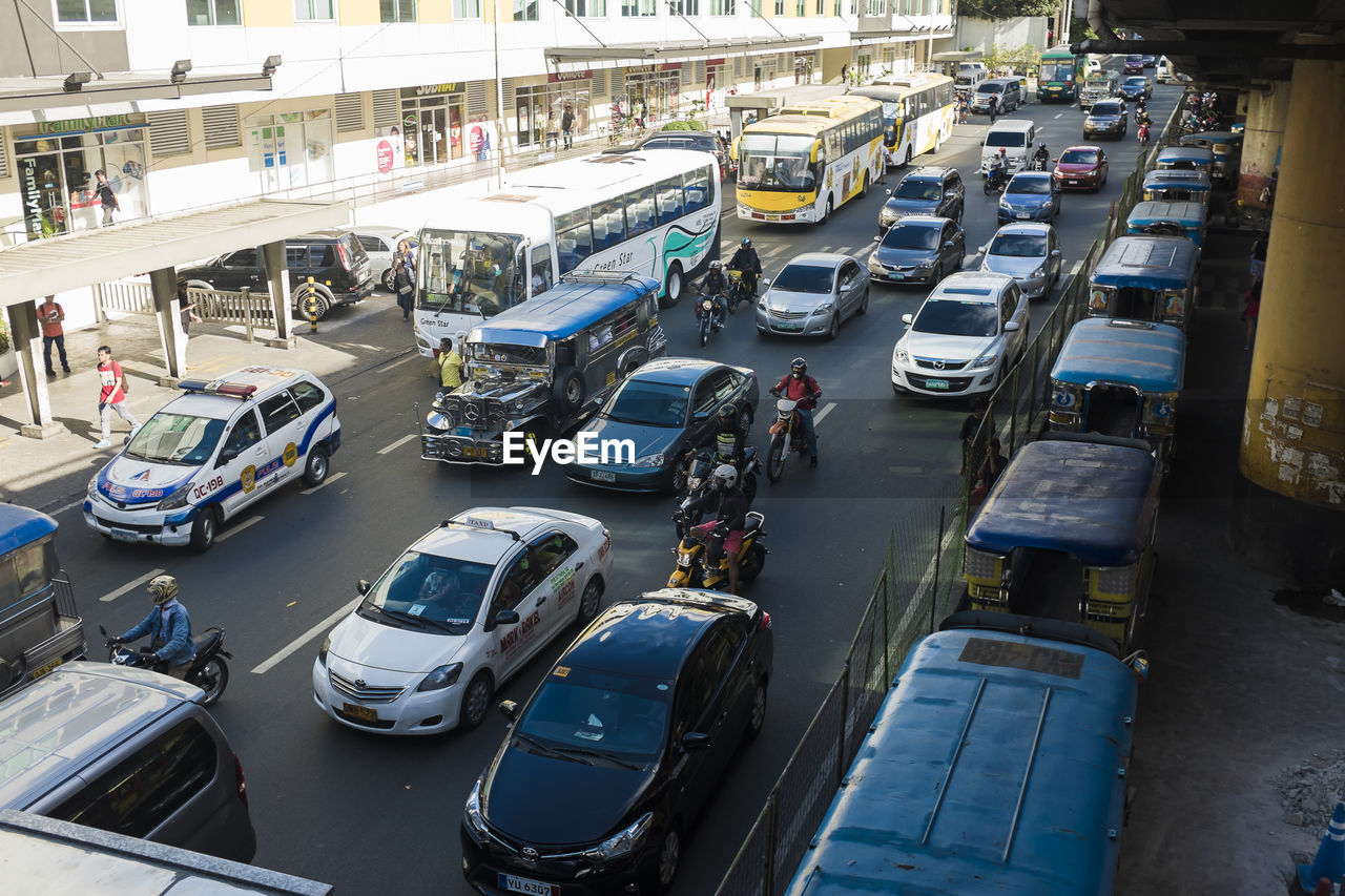 Traffic on city street by building