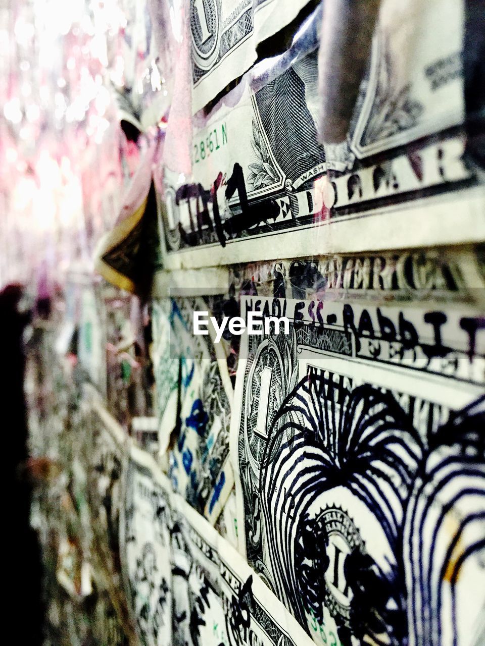 Close-up of drawing on currencies