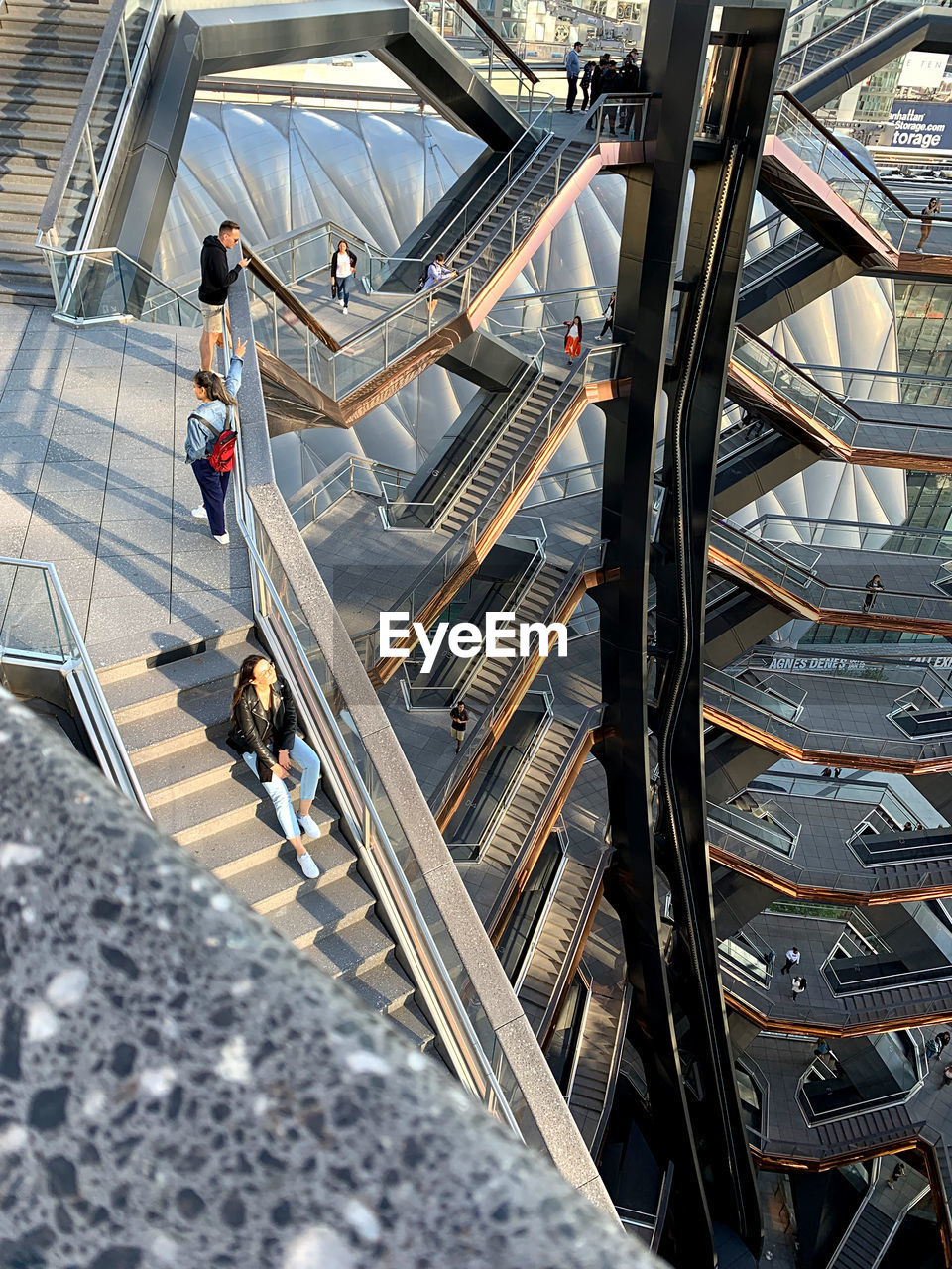 HIGH ANGLE VIEW OF PEOPLE WALKING ON STAIRS