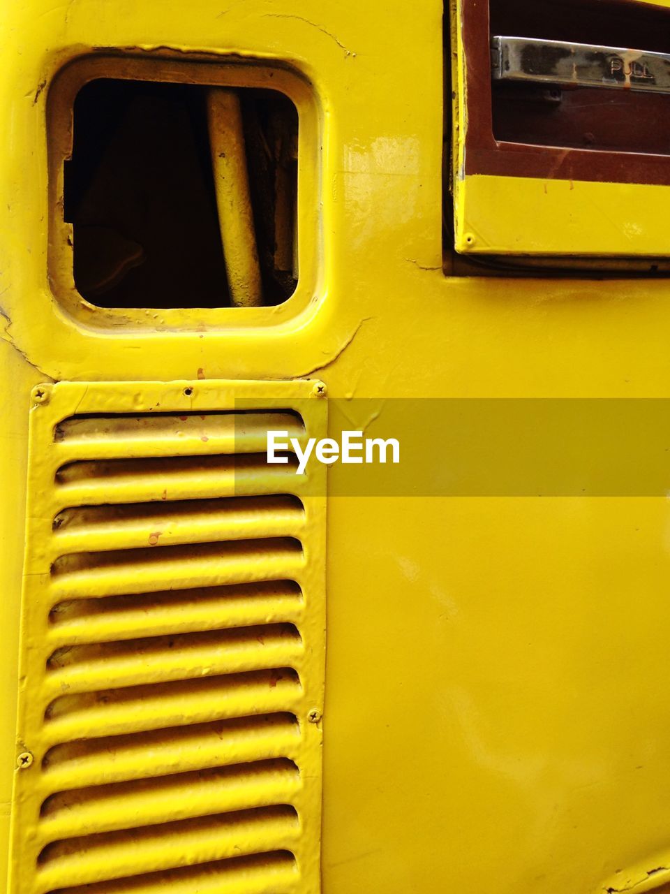 FULL FRAME SHOT OF YELLOW CAR WINDOW