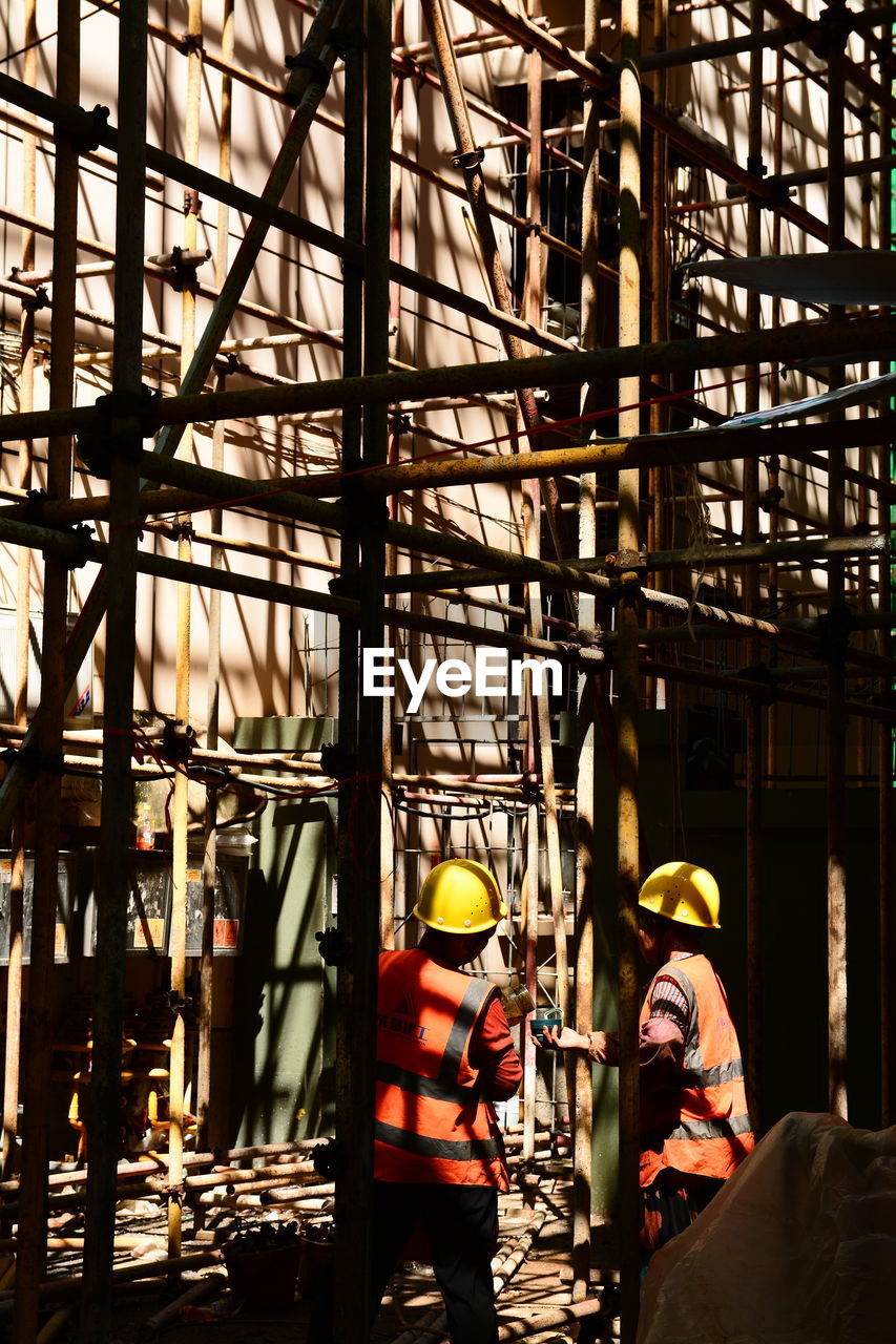 low angle view of man standing in factory