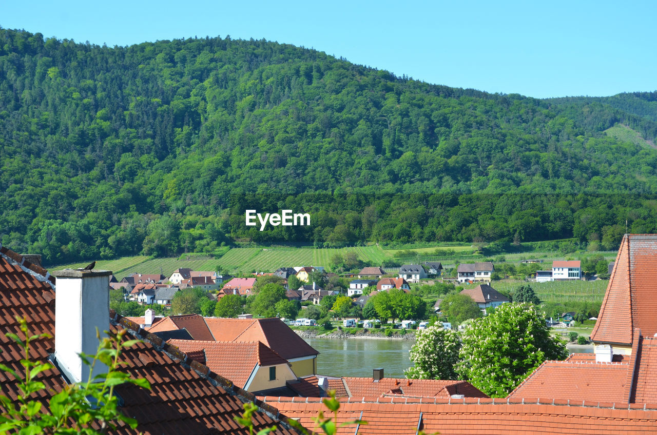 High angle view of townscape against mountains